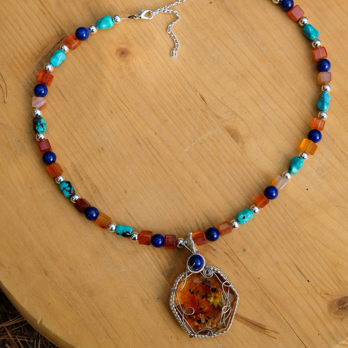 Jasmyn• Orange resin, yellow flowers, pebbles, russula mushrooms, Turquoise, carnelian, sodalite